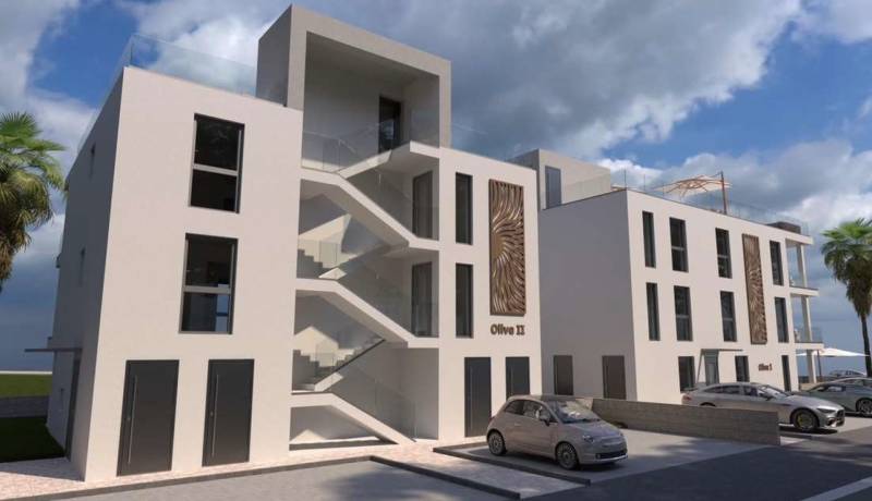 CHORVÁTSKO - Nové apartmány 3 m od mora (3i) - ostrov VIR, Zadar - Moderná budova s parkoviskom a palmami v meste Vir, zahŕňajúca 2-izbový byt.