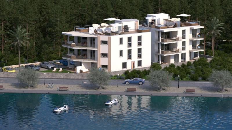 CHORVÁTSKO - Nové apartmány 3 m od mora (5i) - ostrov VIR, Zadar - Moderná budova pri vodnej hladine, obklopená zeleňou a palmami, s parkoviskom.
