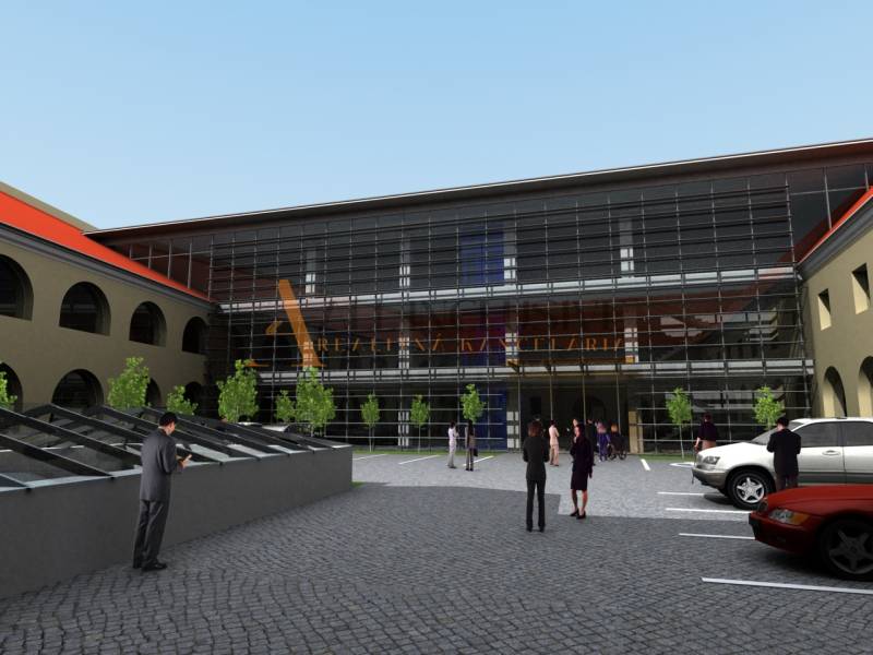 MEŠTIANSKY DOM | TRNAVA | CENTRUM - Sklená fasáda s ľuďmi a autami pred zvláštnymi nehnuteľnosťami na Hollého ulici v Trnave.