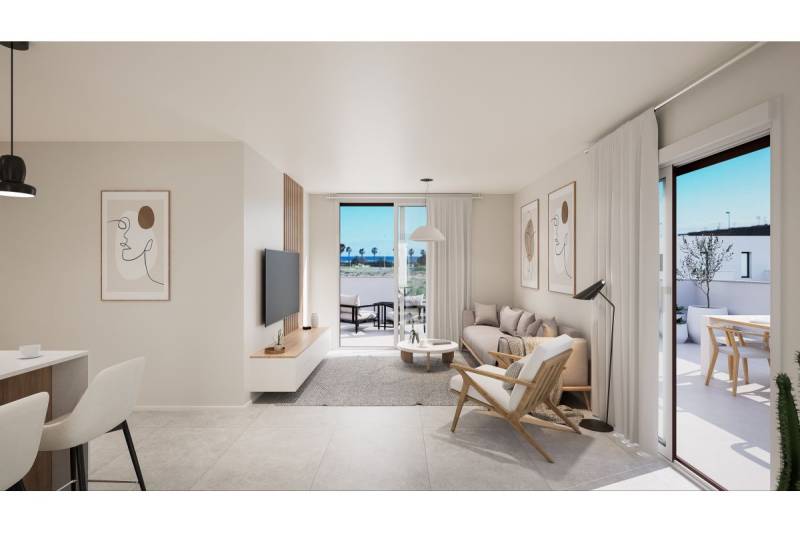 TORRE DE LA HORADADA -  nový rezidenčný komplex len 200 m od pláže - Svetlý interiér Rekreačného apartmánu s obývacou izbou, terasou a moderným nábytkom.