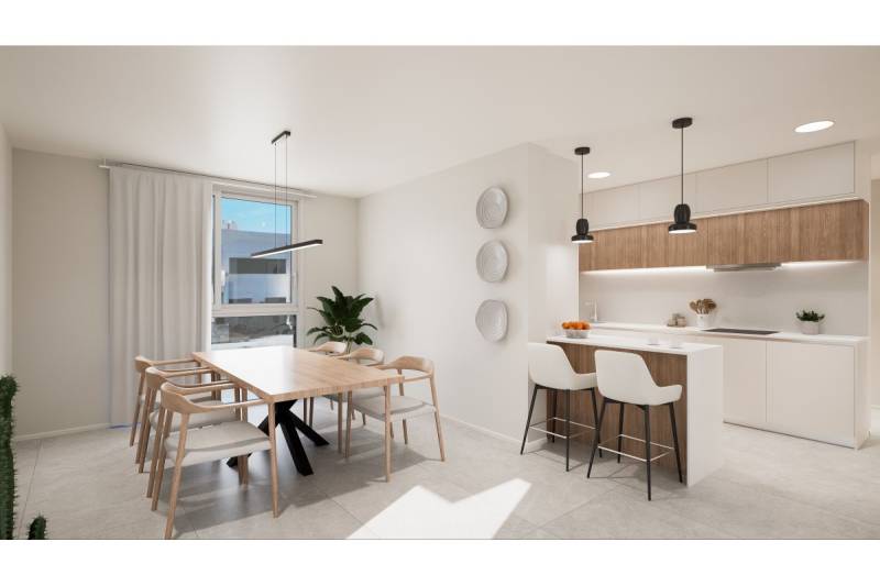TORRE DE LA HORADADA -  nový rezidenčný komplex len 200 m od pláže - Svetlá kuchyňa v Rekreačnom apartmáne s jedálenským stolom a barovým pultom.