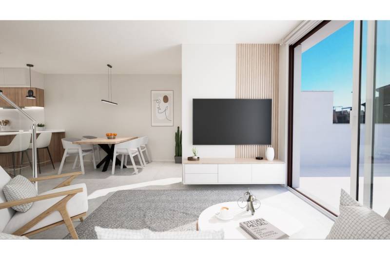 TORRE DE LA HORADADA -  nový rezidenčný komplex len 200 m od pláže - Svetlá obývacia izba v rekreačnom apartmáne s jedálenským stolom a veľkými oknami.