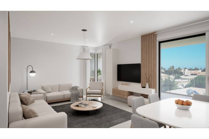 LOS ALCÁZARES -rekreačné apartmány s turistickou licenciou na prenájom - Obývacia izba rekreačného apartmánu s pohovkou, jedálenským stolom a výhľadom von.
