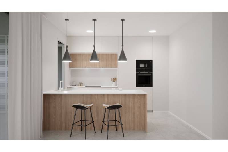 LOS ALCÁZARES -rekreačné apartmány s turistickou licenciou na prenájom - Kuchyňa rekreačného apartmánu s ostrovom, stoličkami a závesnými svetlami.