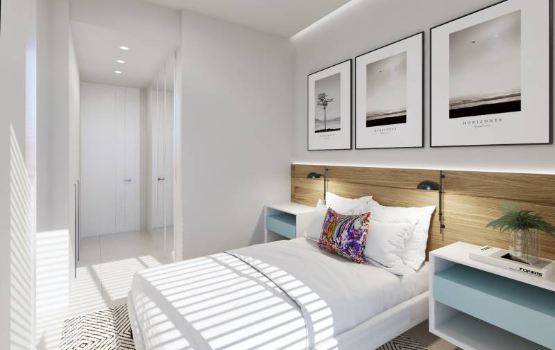 SANTA ROSALIA - Luxusné apartmány s 2 -3 spálňami s výhľadom na jazero - Svetlá spálňa v 3-izbovom byte s bielym nábytkom a dekoratívnymi obrázkami na stene.