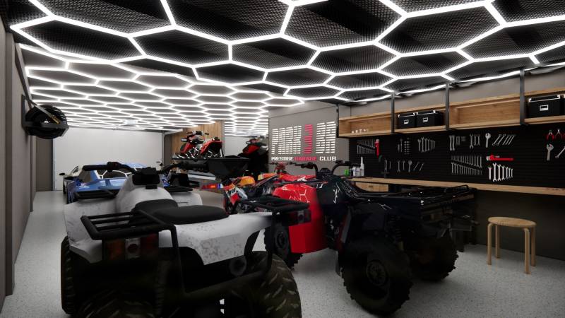 Exkluzívne garáže v projekte PARK3BA, Triblavina, Bratislava - Interiér obchodného priestoru s uskladnenými vozidlami a náradím, futuristická svetelná stropná výzdoba.