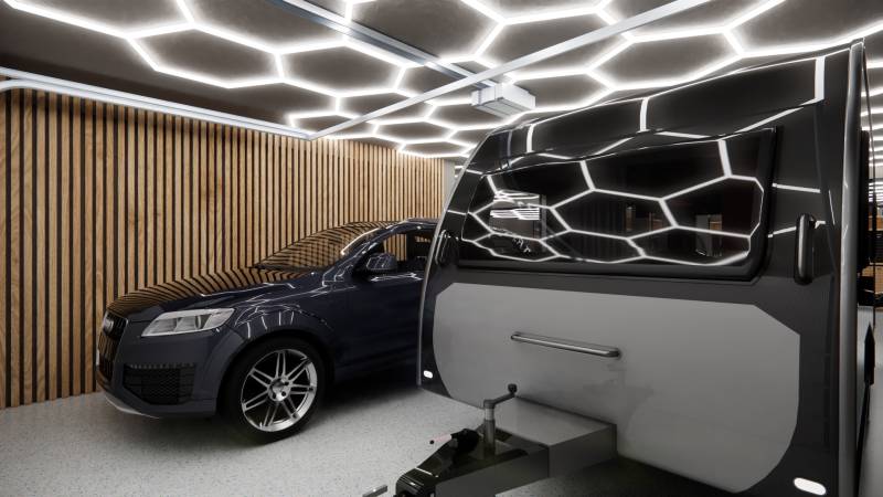 Exkluzívne garáže v projekte PARK3BA, Triblavina, Bratislava - Auto a karavan vo vnútri obchodných priestorov s osvetlením a drevenými stenami.