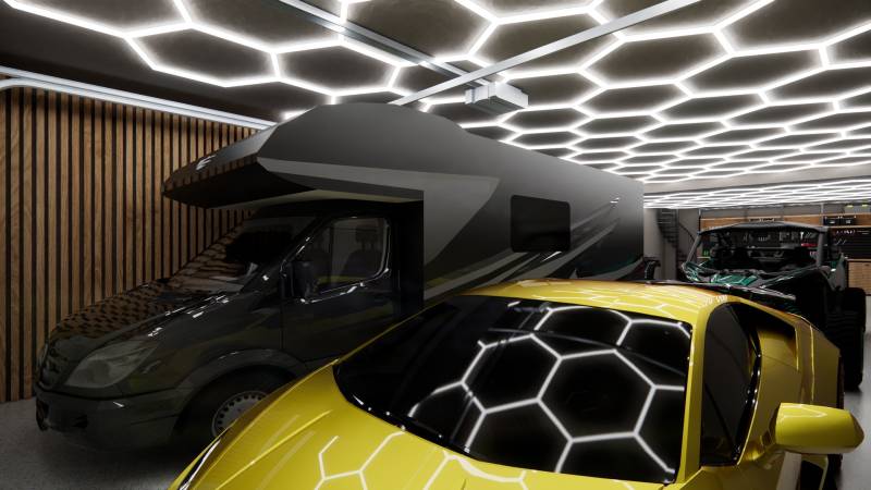 Exkluzívna garáž ( typu B) v projekte PARK3BA, Triblavina, Bratislava - Garniže v obchodnom priestore so svetelným stropom, karavanom a žltým športovým autom.