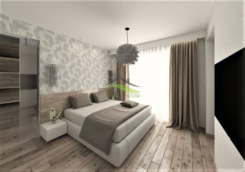 Murovaná Novostavba - Rodinný dom s pekný pozemkom 800 m2 - Spálňa v rodinnom dome s drevenou podlahou a vzorovanými tapetami.