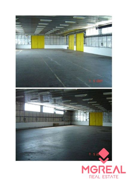 Skladové priestory 770 m2 a 792 m2 v Piešťanoch - Priestory skladu s halami s veľkými žltými dverami a oknami.
