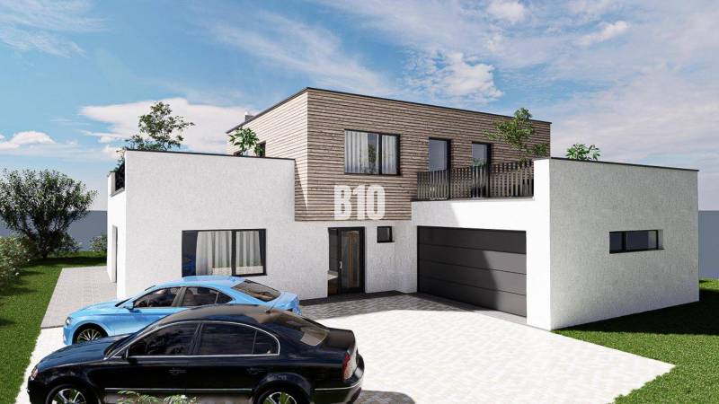 6 izbový rodinný dom  - DVOJGARÁŽ - CABAJ časť Riegler - Rodinný dom s jedným poschodím, garážou a dvoma autami, obklopený zeleňou.