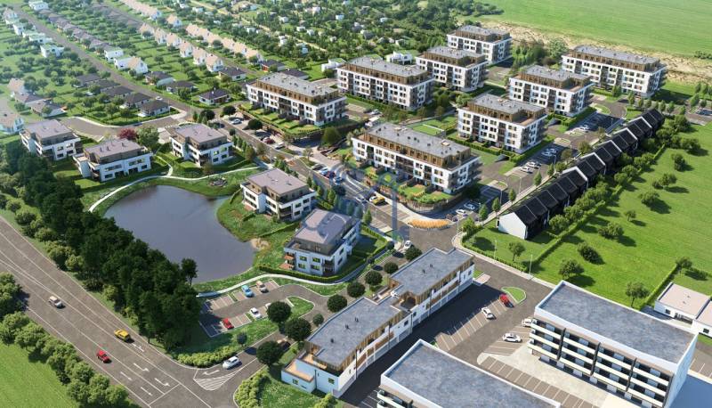 KOLAUDUJEME! Predaj 3-izb. bytu , Nová Tehelňa, Senec (A1102) - Pohľad zhora na novú mestskú štvrť s bytovkami a rybníkom.