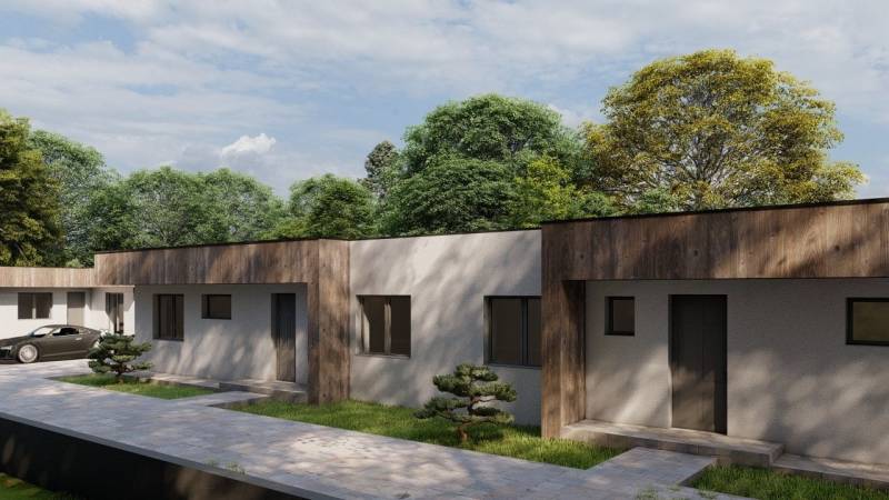 Novostavba 4-izbového rodinného dvojdomu v obci Žihárec - Rodinný dom v Žihárci so súvislou zelenou záhradou a plynulým prechodom chodníka.