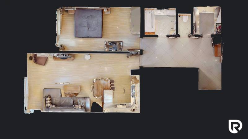 | Svetlý priestranný 2 izbový byt | parkovanie | REZERVOVANÝ - Pôdorys 2-izbového bytu s podlahou s dreveným dekorom a kuchyňou v otvorenom priestore.