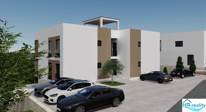 ☀Ciovo/Trogir(HR)-moderné byty v novostavbe s výhľadom na more☀ - Rekreačný apartmán v Ciove so zaparkovanými autami a okolitou zeleňou.