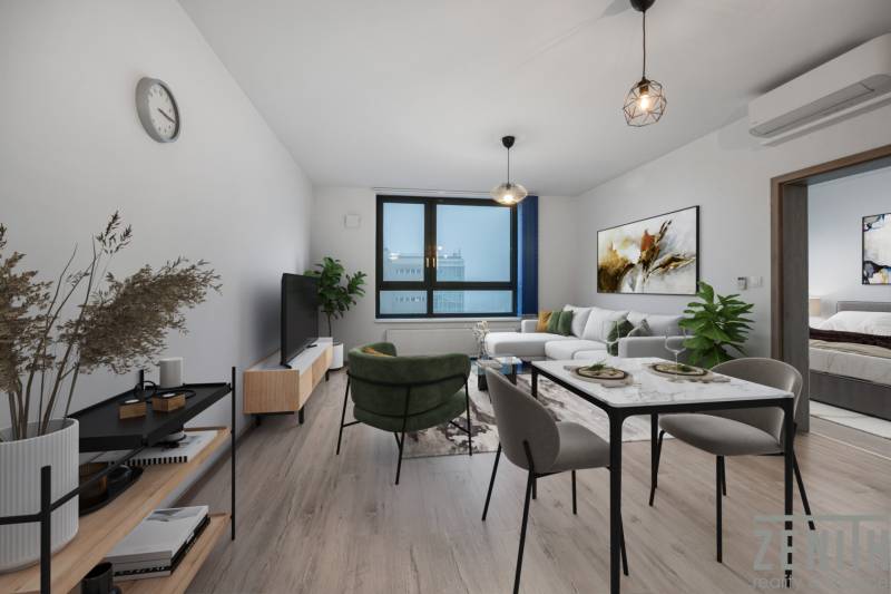 PREDAJ 2-IZBOVÉHO BYTU – NOVOSTAVBA JARABINKY, RUŽINOV - Obývacia izba s pohovkou a jedálenským stolom v 2-izbovom byte, podlaha s dreveným dekorom.