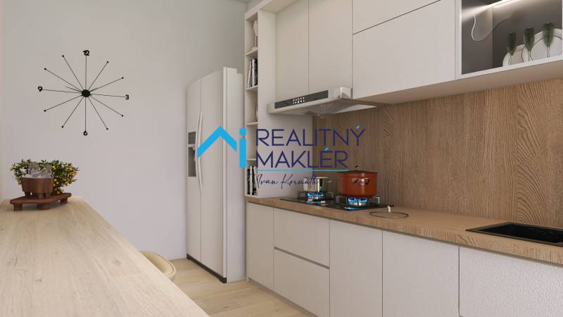 PREDANÉ - 4 izbový byt s loggiou v Petržalke - Kuchyňa s podlahou s dreveným dekorom, hodinami a modernými spotrebičmi v 3-izbovom byte.