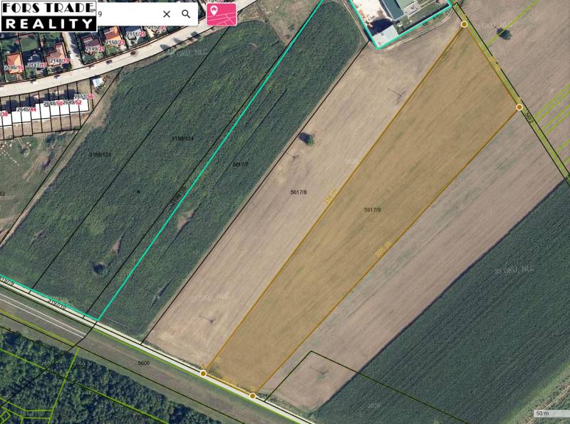 Predám investičný pozemok v Šali -  vhodné na IBV - Letecký pohľad na pole pri výstavbe domov na ulici Fraňa Kráľa.