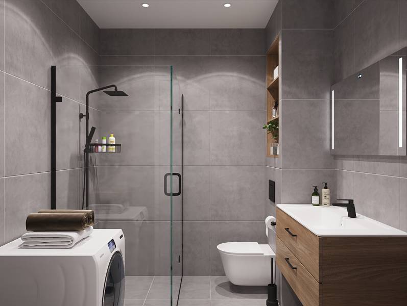 Pripravujeme: Moderná novostavba bytového domu, Byty Maty - Kúpeľňa so sprchovacím kútom, umývadlom a práčkou v 1-izbovom byte.