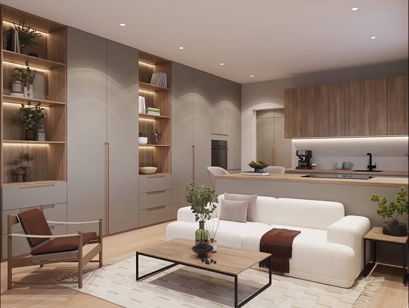 Pripravujeme: Moderná novostavba bytového domu, Byty Maty - Svetlý obývací priestor v 1-izbovom byte s podlahou s dreveným dekorom a vstavanou knižnicou.