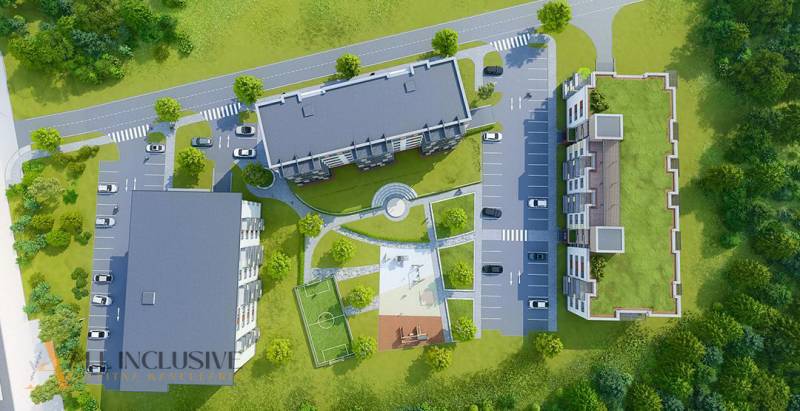 NA PREDAJ 3 IZBOVÉ BYTY DUNAJSKÁ STREDA - Obrázok zobrazuje komplex budov s parkovaním na ulici Júliusa Lőrincza a ihriskom.