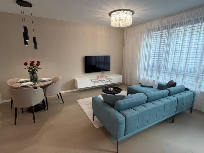 Exk. prenájom lux. 2 iz bytu Rezidencia Blumental - Obývacia izba v 2-izbovom byte s podlahou s dreveným dekorom a pohodlným sedením.