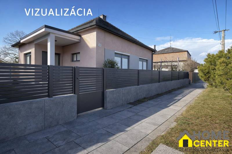 NA PREDAJ 5 izbový rodinný dom s veľkou záhradou v obci Iža - Rodinný dom v Iži s moderným plotom a upraveným chodníkom.
