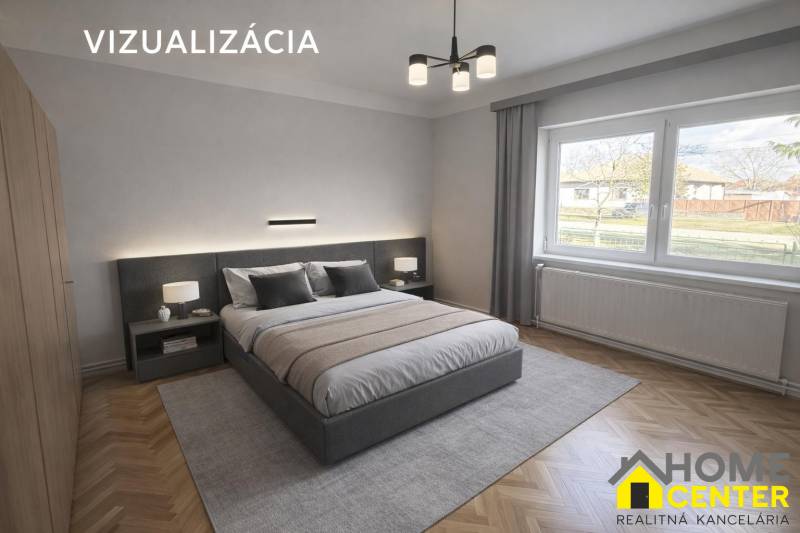 NA PREDAJ 5 izbový rodinný dom s veľkou záhradou v obci Iža - Spálňa v rodinnom dome s kobercovým dekorom a posteľou, veľké okno s výhľadom.