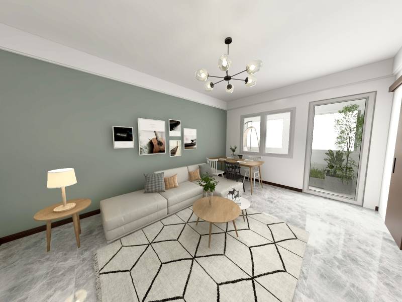 I Predaj 3- izbového bytu v Dúbravke - Obývačka v 3-izbovom byte s pohovkou, stolíkom a umeleckými obrazmi na stene.