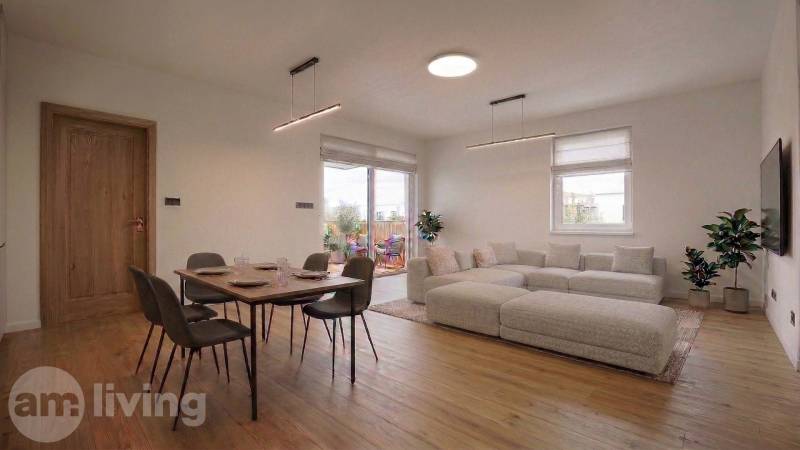 NOVINKA - 2x Novostavba RODINNÝCH DOMOV - Borčice  - Obývacia izba v rodinnom dome s jedálenským stolom a podlahou s dreveným dekorom.