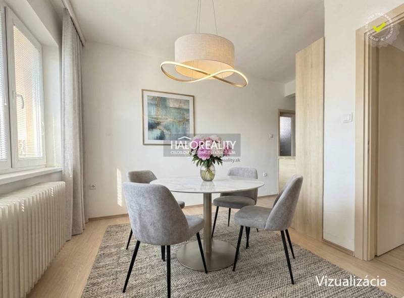 Predaj, rodinný dom Oslany - EXKLUZÍVNE HALO REALITY - Jedálenský kút v rodinnom dome s okrúhlym stolom a elegantným svietidlom.