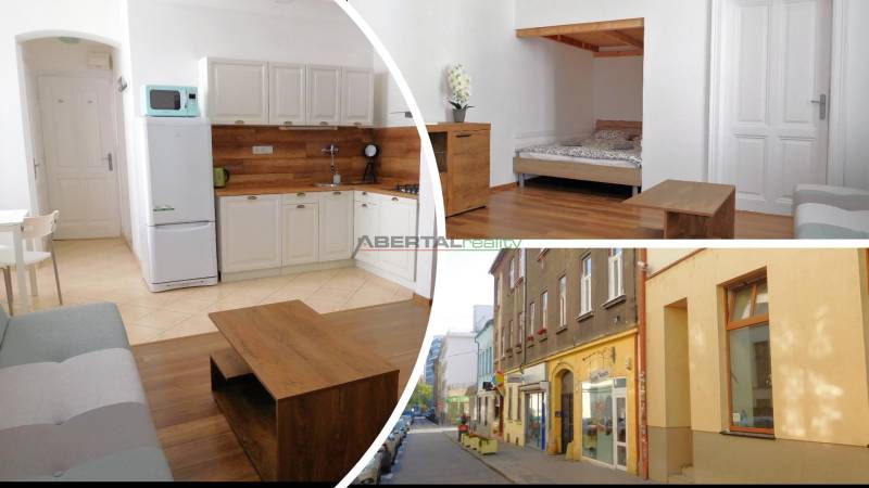 Predaj - štýlový 1,5i byt  v srdci Starého Mesta - Marianska, BA - 2-izbový byt s podlahou s dreveným dekorom a kuchyňou na Mariánskej ulici.