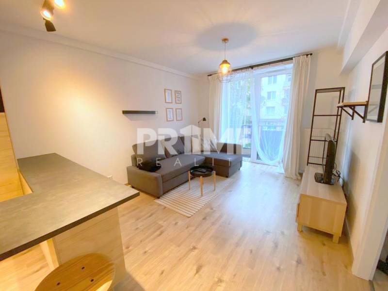 ŠTÝLOVÝ 2i byt, NOVOSTAVBA, BALKÓN, PARKIN, Paričková ulica, NIVY - Obývacia izba 2-izbového bytu na ulici Páričkova, otvorený priestor s balkónom.