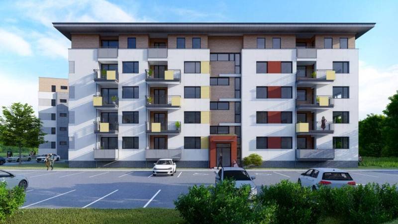 Úžasné 2 a 3 - izbové byty v obytnom parku KISERDŐ LAKÓPARK - Bytový dom s balkónmi na ulici, parkovanie pred 2-izbovým bytom, upravené prostredie.