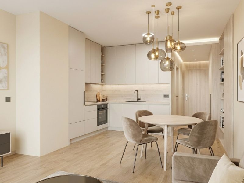I Predaj Výnimočný  1-izb apartmán v projekte Metropolis - Interiér 1-izbového bytu s kuchynskou linkou, okrúhlym stolom a podlahou s dreveným dekorom.