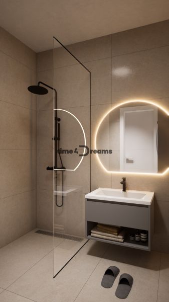 NA PREDAJ dizajnový byt Levice  - Elegantná kúpeľňa v 2-izbovom byte s osvetleným zrkadlom a sprchovým kútom.
