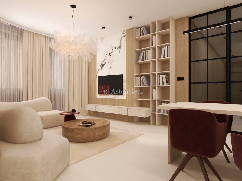 VEĽKORYSÝ 2i byt s rozlohou 76 m² v atraktívnej lokalite- Staré mesto - Obývacia izba v 2-izbovom byte s pohodlnou sedačkou a knihovnicou.