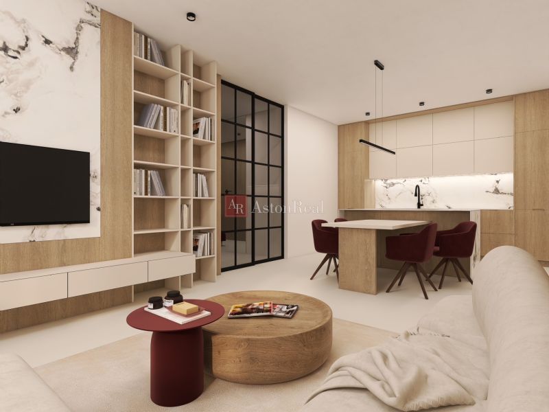 VEĽKORYSÝ 2i byt s rozlohou 76 m² v atraktívnej lokalite- Staré mesto - 2-izbový byt s knižnicou, mramorovým dekórom a kuchyňou s červenými stoličkami.