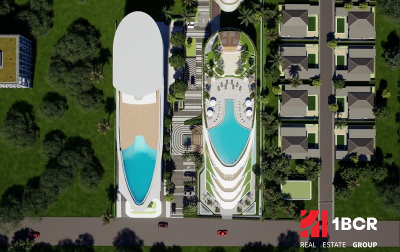 SOLE MIO RESIDENCES PHUKET - Letecký pohľad na výstavbu bytov v Phukete s bazénom a vilami.