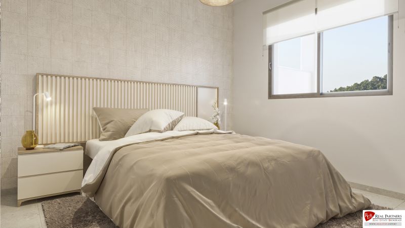 1-izbový apartmán pri pláži, Pulpí, Costa de Almería - Spálňa v rekreačnom apartmáne s posteľou, vzorovanou stenou a veľkým oknom.