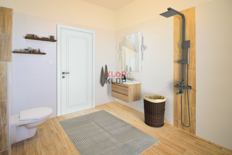 Pozrite si MODERNÚ NOVOSTAVBU 5 i RD pri SENCI, MOŽNOSŤ VÝMENY za BYT - Kúpeľňa v rodinnom dome s veľkým sprchovým kútom, závesným WC a košom na prádlo.