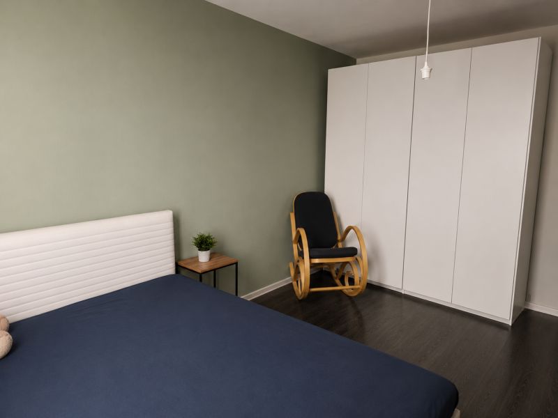 REZERVOVANÝ - Na predaj priestranný 2-izbový byt s balkónom, klímou... - Spálňa v 2-izbovom byte s posteľou, skriňou, hojdacím kreslom a podlahou s dreveným dekorom.