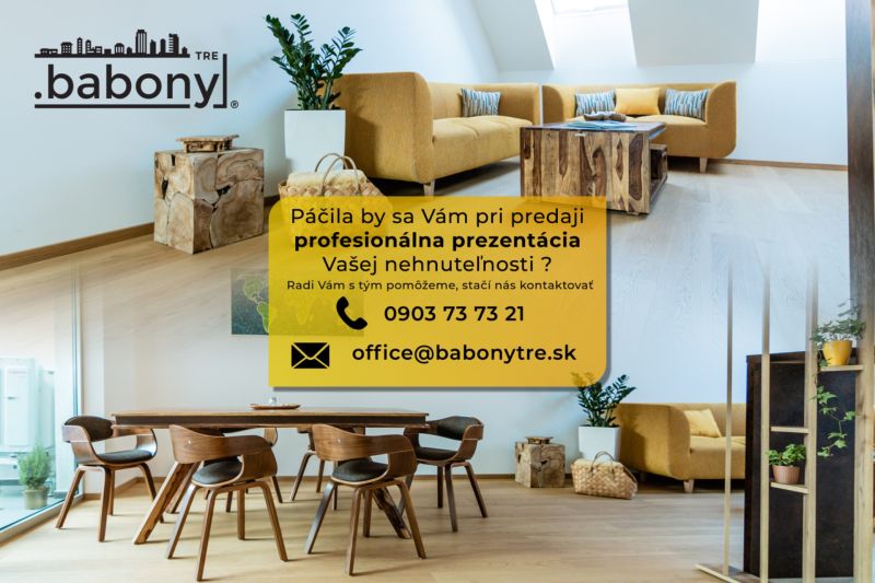 | 1 - izbový byt na ul. Hany Meličkovej, Dlhé diely, BA IV - Obývací priestor s dreveným stolom na ulici Okružná, vhodný pre Pozemky - bývanie.