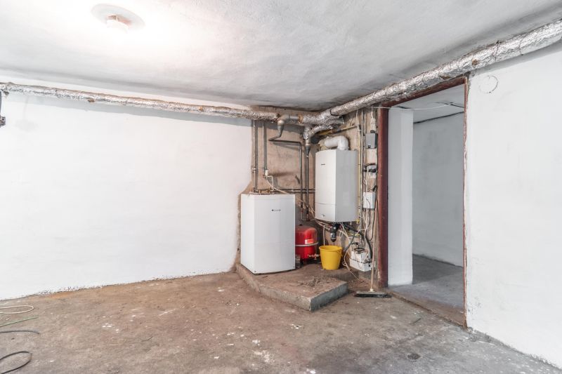 REZERVOVANE  I Na predaj dvojposchodový 5i rodinný dom pri Žiline - Technická miestnosť v rodinnom dome s kotlom a potrubiami na betonovej podlahe.