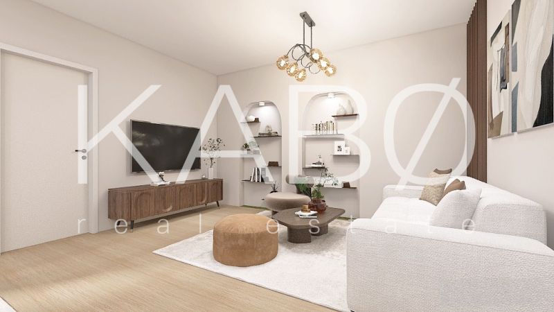 Posledný Voľný - Moderný 4-izbový rodinný dom s terasou a záhradou - Obývacia izba v rodinnom dome s podlahou s dreveným dekorom a bielym nábytkom.