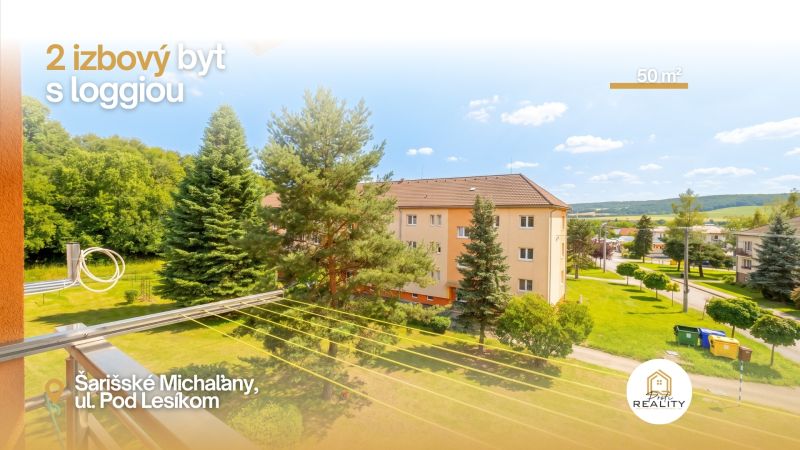 PREDAJ | 2-izb. byt 59 m² + loggia | Š. Michaľany - Zeleň a bytové domy na ulici Pod lesíkom v Šarišských Michaľanoch.