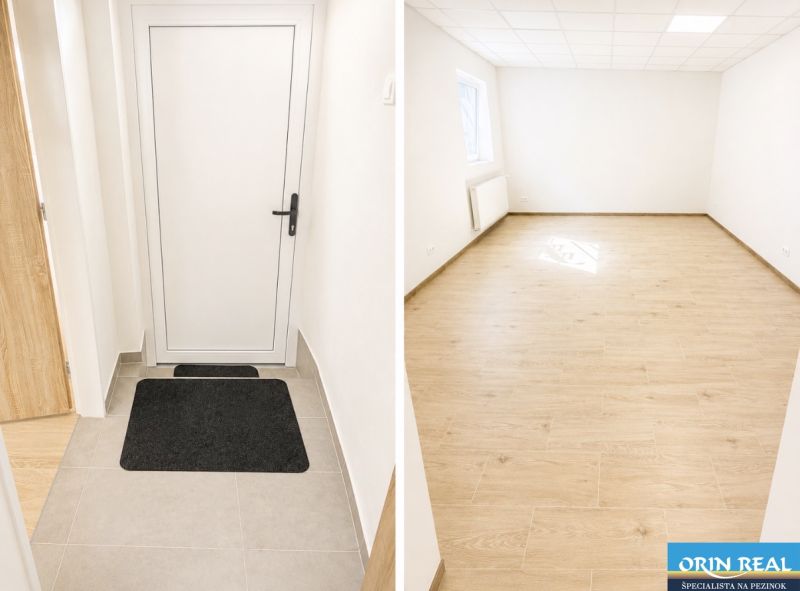 Na prenájom obchodný priestor v centre Pezinka 100m2 - Interiér obchodných priestorov s podlahou s dreveným dekorom a bielymi stenami.