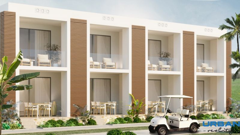Hotelový a rezidenčný komplex THE TERRACE v Paje, Zanzibar - Záber na vonkajšie balkóny obytnej budovy vo výstavbe, Paje, obklopené zelenou vegetáciou.