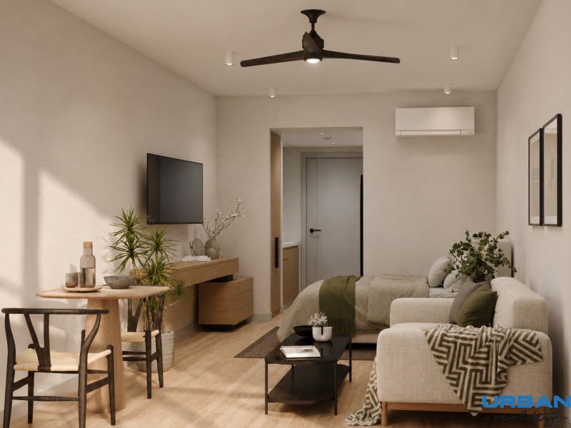 Hotelový a rezidenčný komplex THE TERRACE v Paje, Zanzibar - Interiér v neutrálne ladenom byte s podlahou s dreveným dekorom a zariadením.